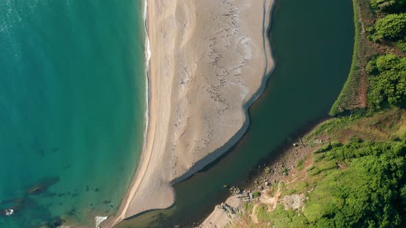 Exotic sandy beach surrounded by sea and river