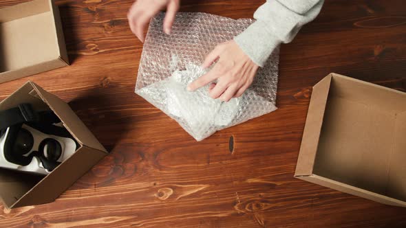 Wrapping Joystick and Virtual Reality Glasses Into Box Top View