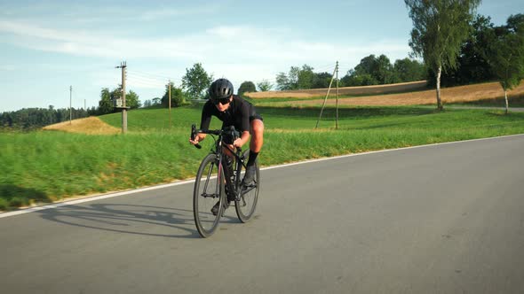 Female road cyclist bicycle downhill