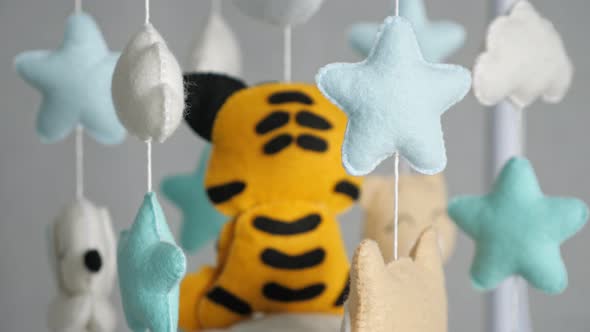 Little Tiger Toy and Colorful Stars with Clouds Above Bed
