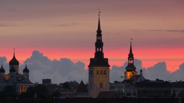 Sunset View of Tallinn, Estonia. Red Clouds and Silhouettes of Roofs.