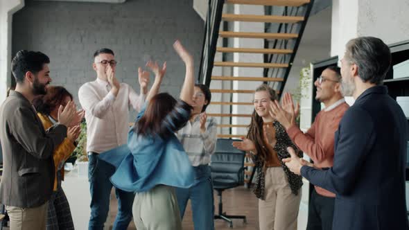 Slow Motion of Cheerful Office Workers Having Fun Dancing at Corporate Party