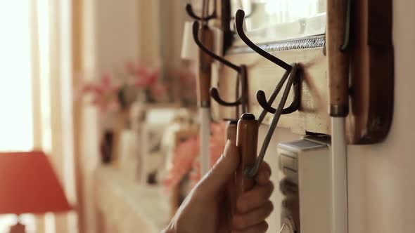 Blind Man picking up White cane at Home.