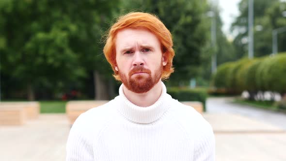 Portrait of Sad Man with Red Hairs, Outdoor