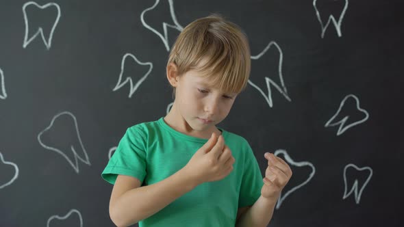 Little Boy Shows That Some of His Milk Teeth Had Fallen Out. Concept of Tooth Change in Children