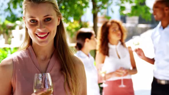 Beautiful woman holding a glass of wine at restaurant