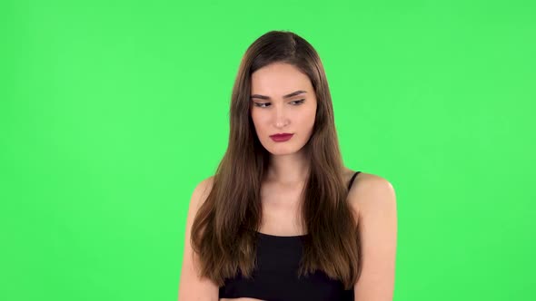 Lovely Girl Is Very Offended and Looks Away. Green Screen