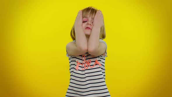 Tired Sad Upset Child Kid Girl Leaning on Hand Looking at Camera with Bored Indifferent Expression