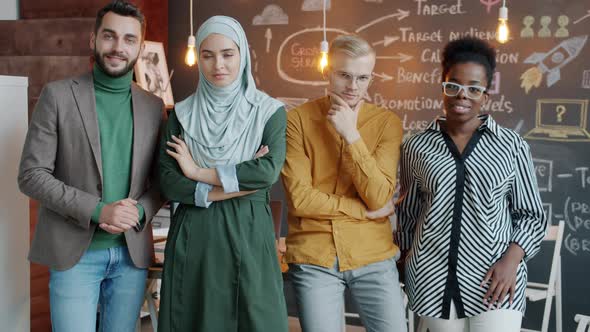 Slow Motion Portrait of Cheerful Business Men and Women Coworkers Standing in Creative Office