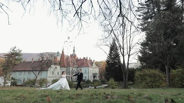 Couple in Wedding Dress Walks