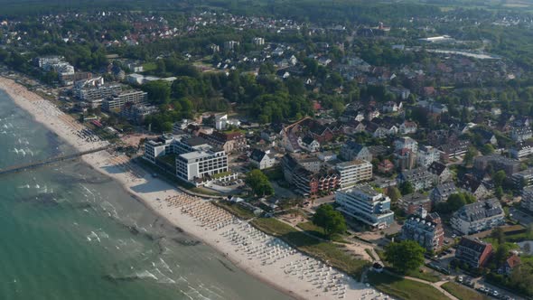 Beautiful High Aerial Drone View of Tourist Baltic Sea Beach in Scharbeutz Germany Forward Day