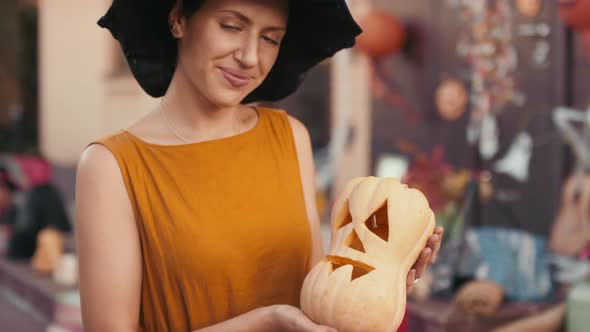 Portrait of Woman with Carved Pumpkin