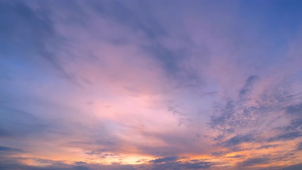 4K Time lapse of colorful sky during beautiful sunset. Romantic clouds