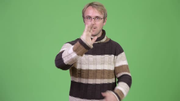Studio Shot of Serious Man Showing Stop Gesture