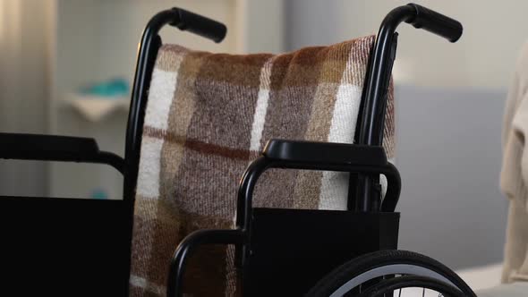 Unhappy Lonely Woman Sitting in Wheelchair in Nursing Home, Feeling Homesick