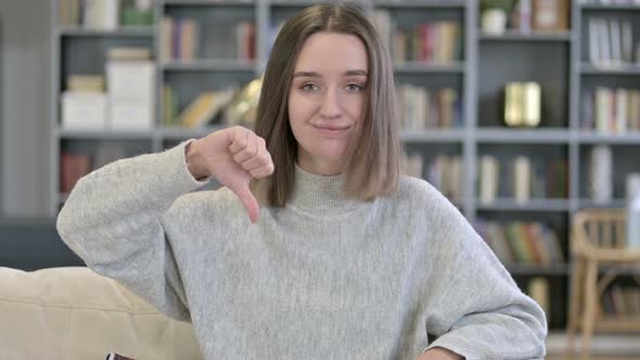 Portrait of Young Woman Doing Thumbs Down