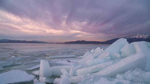 Color streaks in the clouds looking past ice stacks on Utah Lake