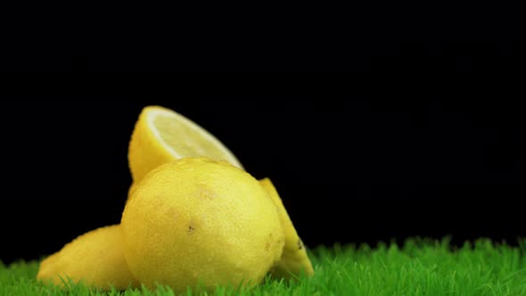 Close look of fresh organic lemons covered in water drops