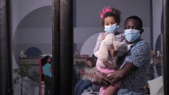 Masked Dad with Girl Looking Through House Window