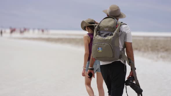 Two people visiting the Badwater Basin