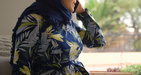Woman in hijaab talking on mobile phone 