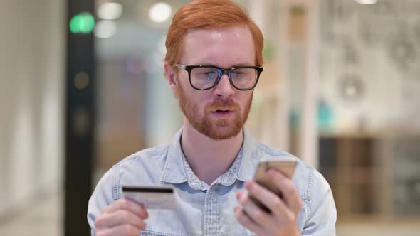 Portrait of Casual Redhead Man with Online Payment Failure on Smartphone 