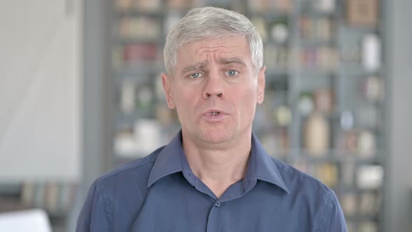 Portrait of Shocked Man Getting Upset in Office