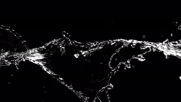 Super Slow Motion Shot of Swirling and Splashing Water Isolated on Black Background at 1000Fps