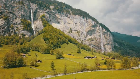Aerial Shot of Lauterbrunnen Switzerland Showing Amazing Green Valley in Between Huge Mountains and