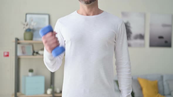 Close Up of Athletic Man Exercising with Dumbbells