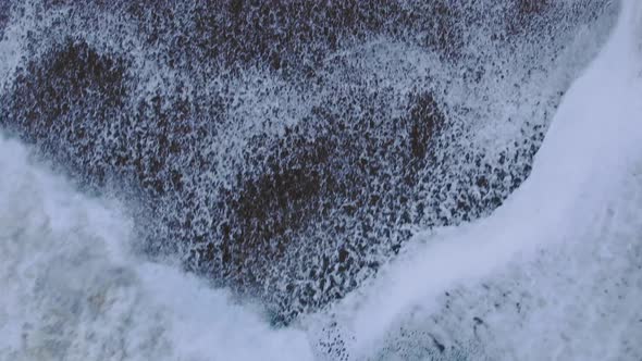 Beautiful Wave with Heavy Foam Rolls on Beach Upper View