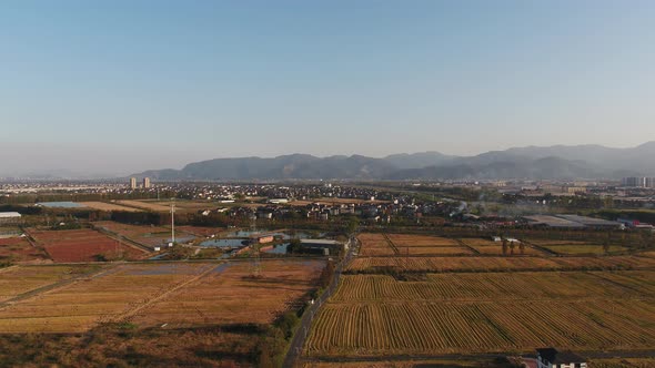 Mountain village and farmland in the sunset