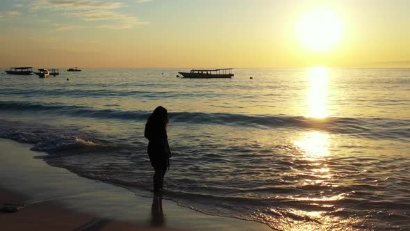 Woman tanning on luxury seashore beach holiday by clear ocean with white sand background of the Mald