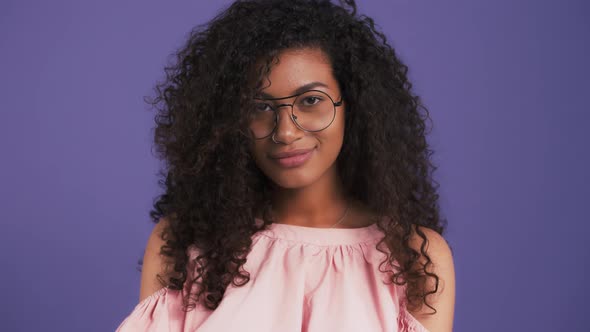 Afroamerican Girl in Sunglasses and Pink Blouse