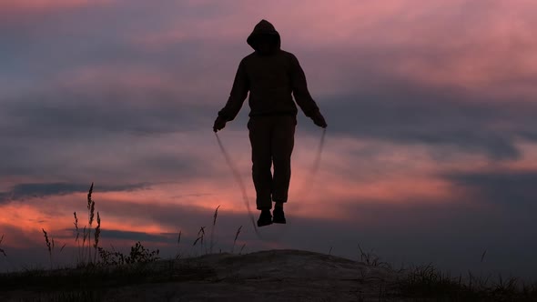 Athlete Jumping Rope Mountain Athletic Man. Health Concept.