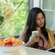 Young woman relaxing with book and hot drink - VideoHive Item for Sale