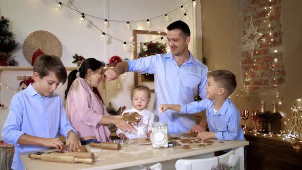 Whole Family is Making Cookies Together for Christmas and Having Fun