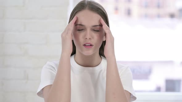 Portrait of Hardworking Young Woman Having Headache 