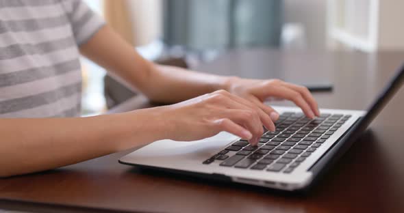 Woman type on her laptop computer