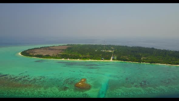 Aerial drone view seascape of relaxing bay beach break by shallow lagoon and white sand background o