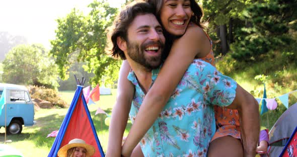 Hipster man holding his girlfriend