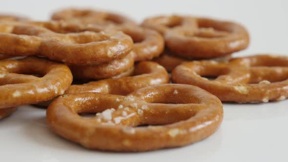 Close-up pile of pretzel  snack on white background  4K 2160p 30fps UltraHD tilting footage - Fresh 