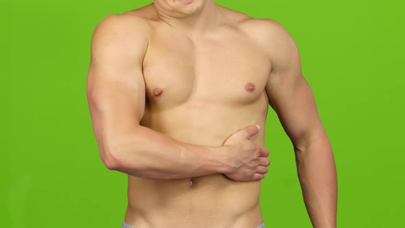 Muscular Man Make Massage on Left Side. Green Screen, Closeup