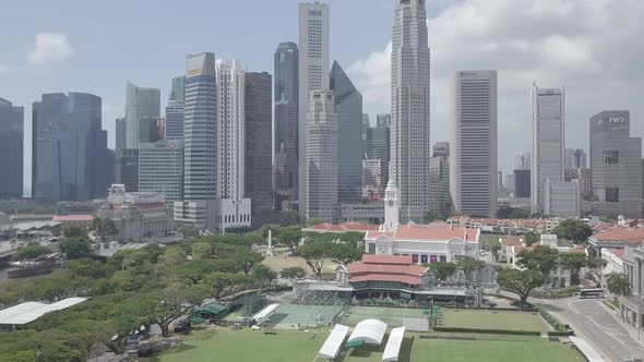 Aerial view of Singapore Marina Bay Sands mall with canal, road, cars. Modern skyscrapers in city.