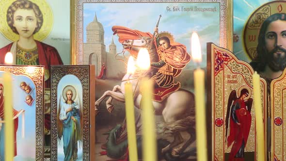 Orthodox Icons And Candles In The Temple