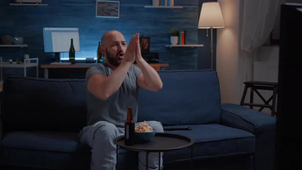 Football Fan Watching Sport Game Supporting Team Raising Hands After Winning