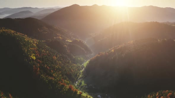 Aerial Autumn Forest at Sun Mountain Range