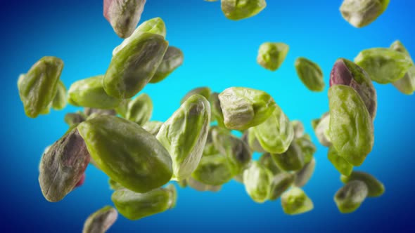 Flying of Peeled Pistachios in Blue Background