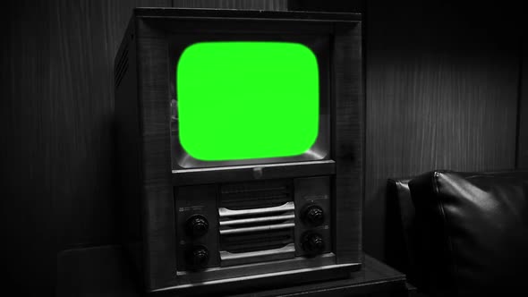 Old TV Set with Green Screen. Black and White Tone. Zoom In.