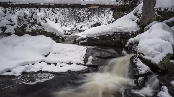 Waterfall in winter. A long waterfall in the Jizera Mountains